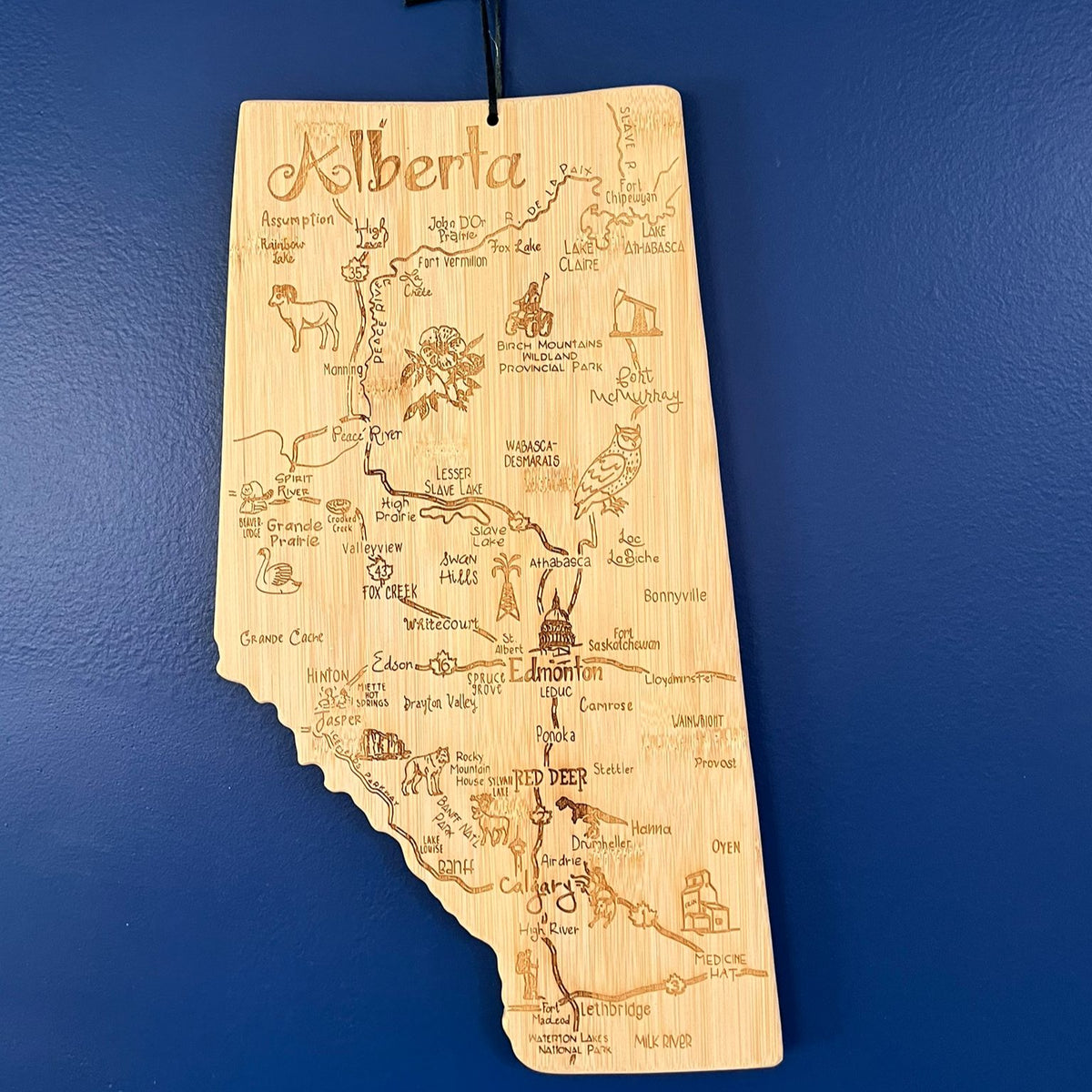 Wooden map of Alberta on a blue wall